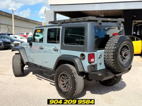 Another view of 2014 Jeep Wrangler Unlimited Sport for sale in Jacksonville, FL at AUTOLAND