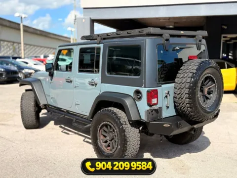 Another view of 2014 Jeep Wrangler Unlimited Sport for sale in Jacksonville, FL at AUTOLAND
