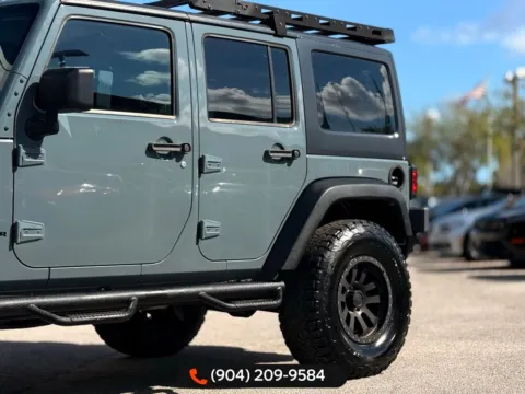 More photos of 2014 Jeep Wrangler Unlimited Sport at AUTOLAND, FL