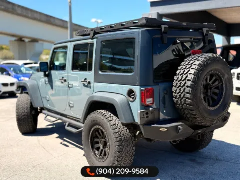 Another view of 2014 Jeep Wrangler Unlimited Sport for sale in Jacksonville, FL at AUTOLAND
