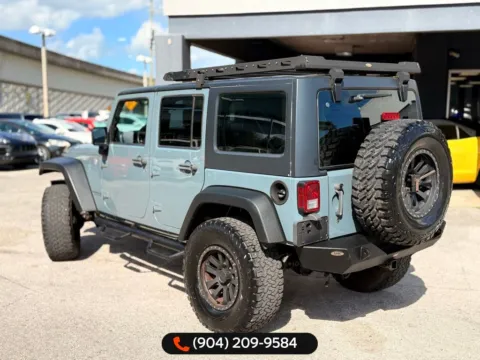 Another view of 2014 Jeep Wrangler Unlimited Sport for sale in Jacksonville, FL at AUTOLAND