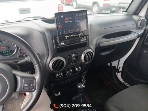 Another view of 2016 Jeep Wrangler Unlimited Sport for sale in Jacksonville, FL at AUTOLAND