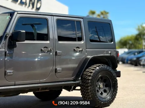 Another view of 2016 Jeep Wrangler Unlimited Freedom Edition for sale in Jacksonville, FL at AUTOLAND