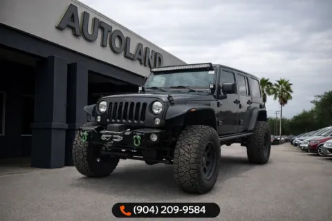 Gray 2016 Jeep Wrangler Unlimited Freedom Edition for sale in Jacksonville, FL