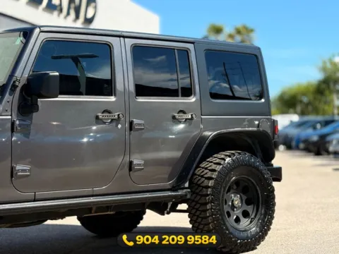 Another view of 2016 Jeep Wrangler Unlimited Freedom Edition for sale in Jacksonville, FL at AUTOLAND