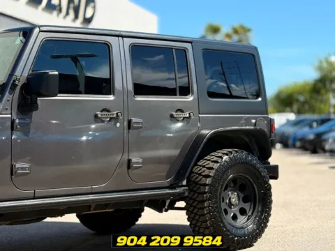 Another view of 2016 Jeep Wrangler Unlimited Freedom Edition for sale in Jacksonville, FL at AUTOLAND