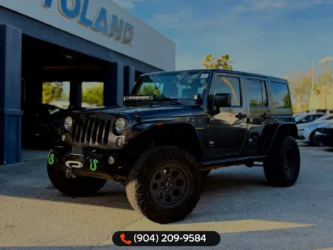 Gray 2016 Jeep Wrangler Unlimited Freedom Edition for sale in Jacksonville, FL