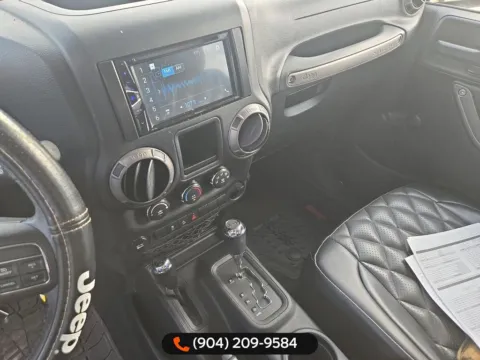 More photos of 2014 Jeep Wrangler Willys Wheeler at AUTOLAND, FL