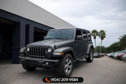 Gray 2017 Jeep Wrangler Unlimited Sahara for sale in Jacksonville, FL