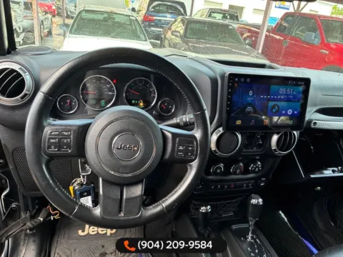 Another view of 2017 Jeep Wrangler Unlimited Sahara for sale in Jacksonville, FL at AUTOLAND