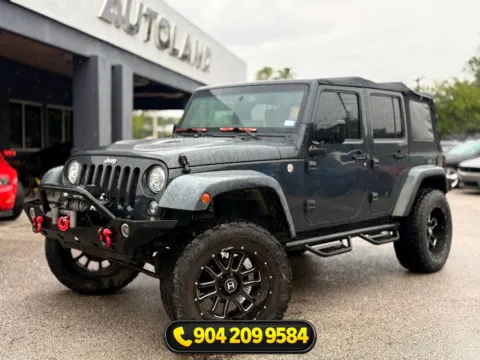 Black 2015 Jeep Wrangler Unlimited Sahara for sale in Jacksonville, FL