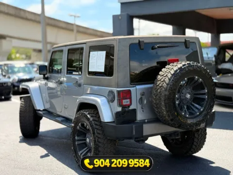Another view of 2014 Jeep Wrangler Unlimited Freedom Edition for sale in Jacksonville, FL at AUTOLAND