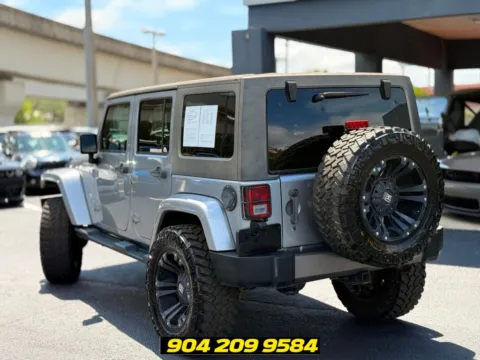 Another view of 2014 Jeep Wrangler Unlimited Freedom Edition for sale in Jacksonville, FL at AUTOLAND