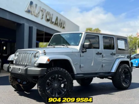 Silver 2014 Jeep Wrangler Unlimited Freedom Edition for sale in Jacksonville, FL