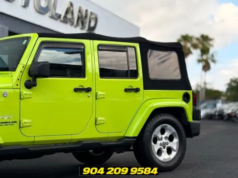 Another view of 2013 Jeep Wrangler Unlimited Sahara for sale in Jacksonville, FL at AUTOLAND