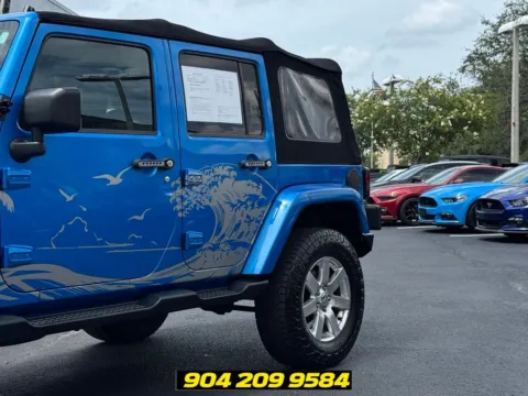 Another view of 2016 Jeep Wrangler Unlimited Sahara for sale in Jacksonville, FL at AUTOLAND