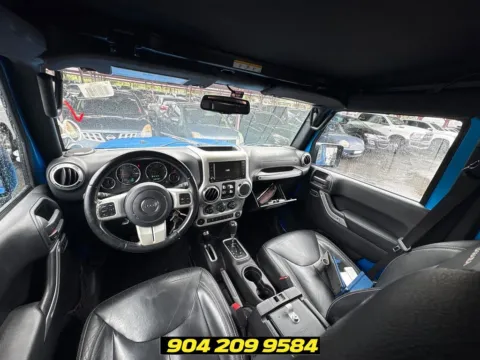 Another view of 2016 Jeep Wrangler Unlimited Sahara for sale in Jacksonville, FL at AUTOLAND