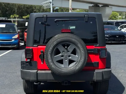 Another view of 2015 Jeep Wrangler Unlimited Sport for sale in Jacksonville, FL at AUTOLAND