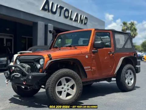 Orange 2010 Jeep Wrangler Sport for sale in Jacksonville, FL