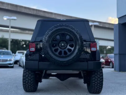 More photos of 2014 Jeep Wrangler Unlimited Sport SUV 4D at AUTOLAND, FL