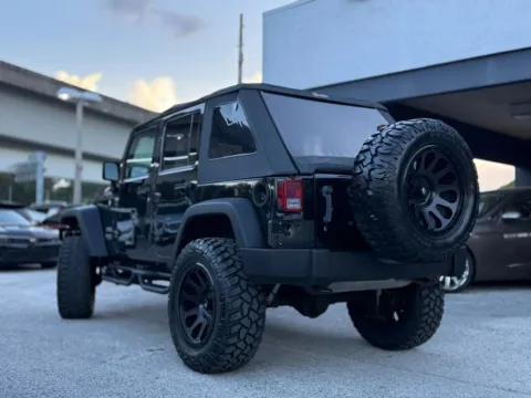 More photos of 2014 Jeep Wrangler Unlimited Sport SUV 4D at AUTOLAND, FL