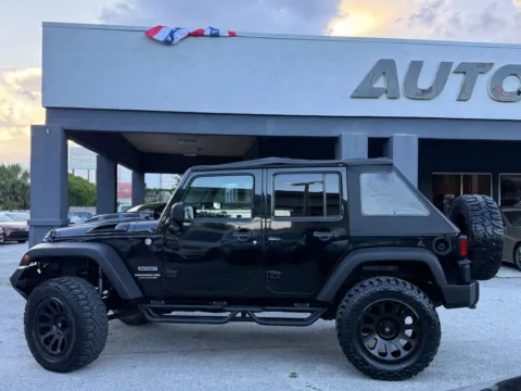 Another view of 2014 Jeep Wrangler Unlimited Sport SUV 4D for sale in Jacksonville, FL at AUTOLAND