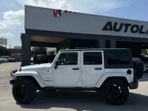 Another view of 2014 Jeep Wrangler Unlimited Sahara Sport Utility 4D for sale in Jacksonville, FL at AUTOLAND