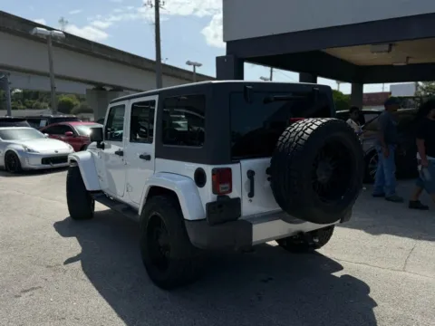 More photos of 2014 Jeep Wrangler Unlimited Sahara Sport Utility 4D at AUTOLAND, FL