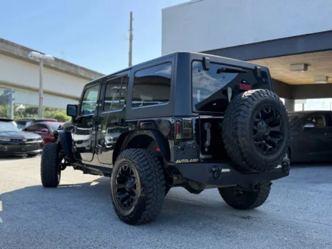 Another view of 2015 Jeep Wrangler Unlimited Sport SUV 4D for sale in Jacksonville, FL at AUTOLAND