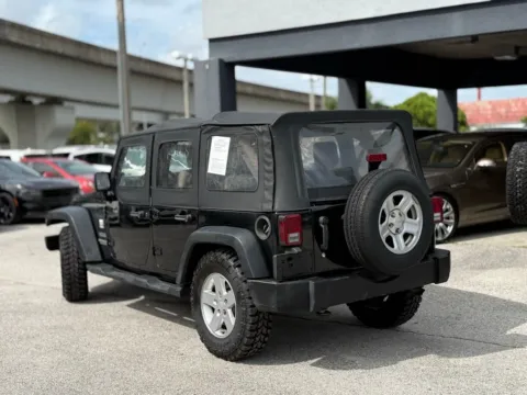 Another view of 2010 Jeep Wrangler Unlimited Sport for sale in Jacksonville, FL at AUTOLAND