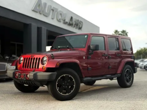 Red 2012 Jeep Wrangler Unlimited Sahara for sale in Jacksonville, FL