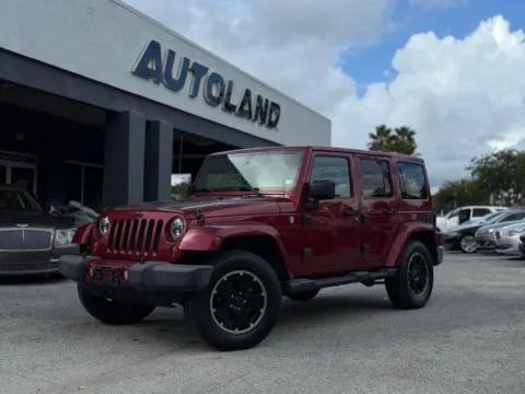 Red 2012 Jeep Wrangler Unlimited Sahara for sale in Jacksonville, FL