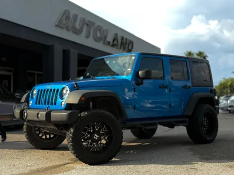 Blue 2016 Jeep Wrangler Unlimited Sport for sale in Jacksonville, FL