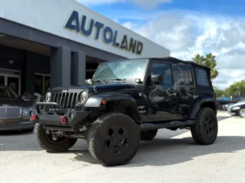 Black 2016 Jeep Wrangler Unlimited Sahara for sale in Jacksonville, FL