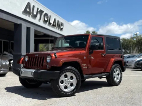 Red 2014 Jeep Wrangler Sahara for sale in Jacksonville, FL