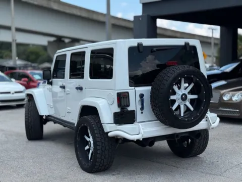 Another view of 2013 Jeep Wrangler Unlimited Sahara for sale in Jacksonville, FL at AUTOLAND
