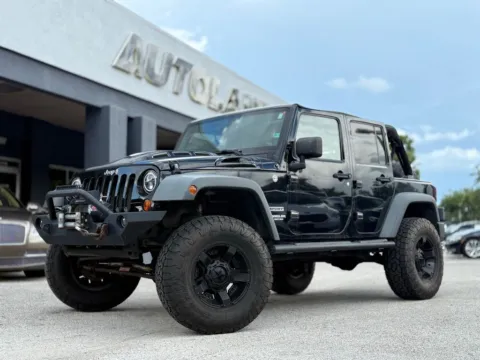 Black 2011 Jeep Wrangler Unlimited Sport for sale in Jacksonville, FL