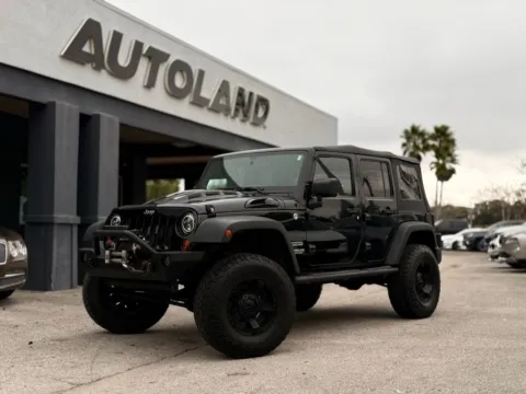 Black 2011 Jeep Wrangler Unlimited Sport for sale in Jacksonville, FL