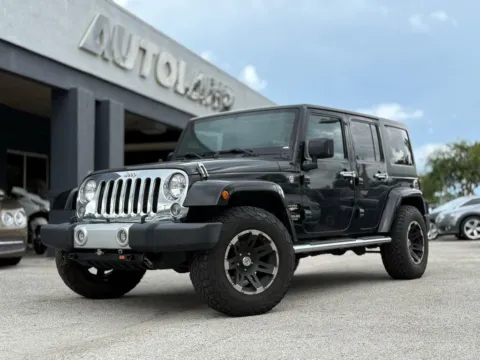 Black 2015 Jeep Wrangler Unlimited Sahara for sale in Jacksonville, FL
