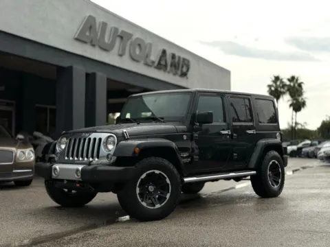 Black 2015 Jeep Wrangler Unlimited Sahara for sale in Jacksonville, FL