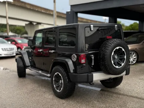 Another view of 2015 Jeep Wrangler Unlimited Sahara for sale in Jacksonville, FL at AUTOLAND