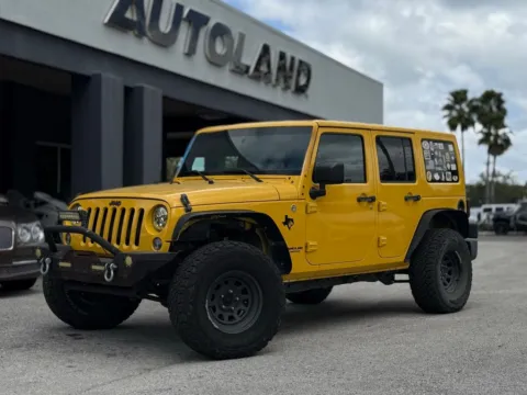 Yellow 2015 Jeep Wrangler Unlimited Sahara for sale in Jacksonville, FL