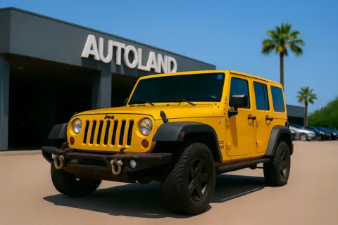 Yellow 2015 Jeep Wrangler Unlimited Sahara for sale in Jacksonville, FL