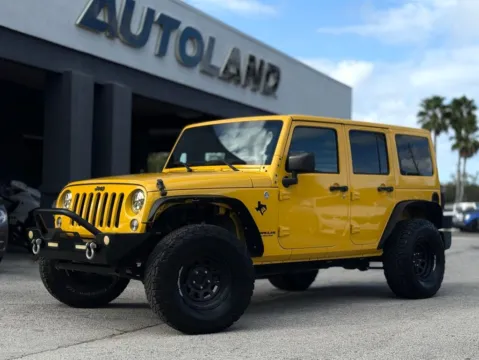 Yellow 2015 Jeep Wrangler Unlimited Sahara for sale in Jacksonville, FL