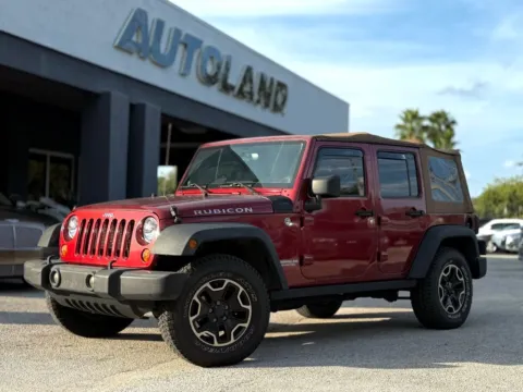 Red 2013 Jeep Wrangler Unlimited Rubicon for sale in Jacksonville, FL