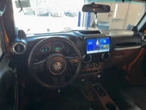 Another view of 2012 Jeep Wrangler Unlimited Sahara for sale in Jacksonville, FL at AUTOLAND