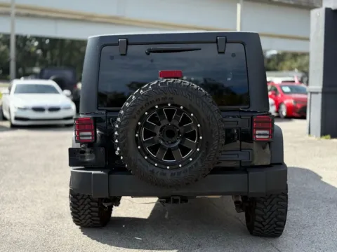 Another view of 2015 Jeep Wrangler Unlimited Sport for sale in Jacksonville, FL at AUTOLAND