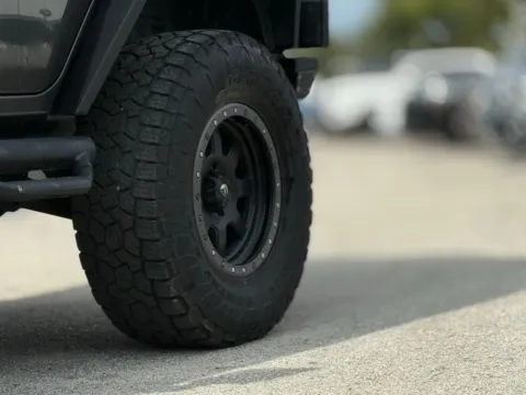 Another view of 2014 Jeep Wrangler Unlimited Sport for sale in Jacksonville, FL at AUTOLAND