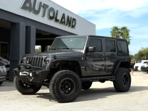 Gray 2014 Jeep Wrangler Unlimited Sport for sale in Jacksonville, FL