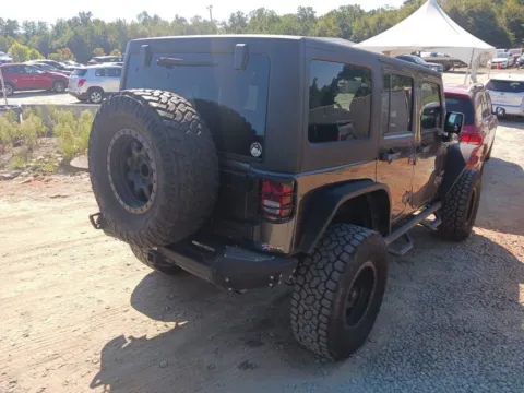 Another view of 2014 Jeep Wrangler Unlimited Sport for sale in Jacksonville, FL at AUTOLAND